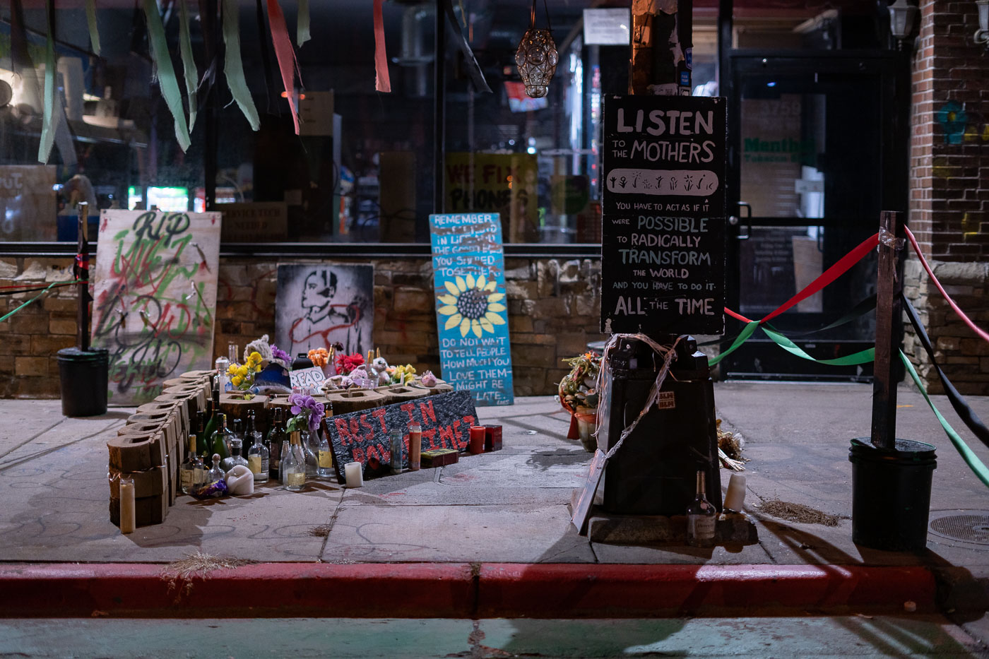 Imez Wright Memorial outside the door of Cup Foods