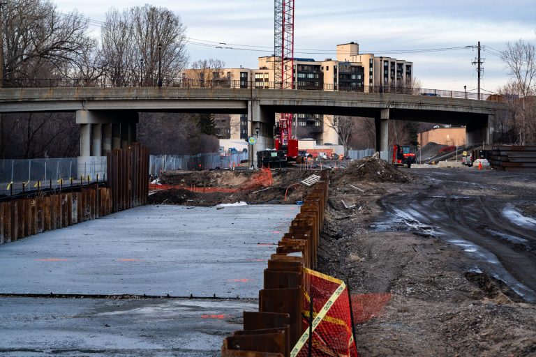 Construction site for Kenilworth Light Rail Transit tunnel under bridge in Minneapolis.