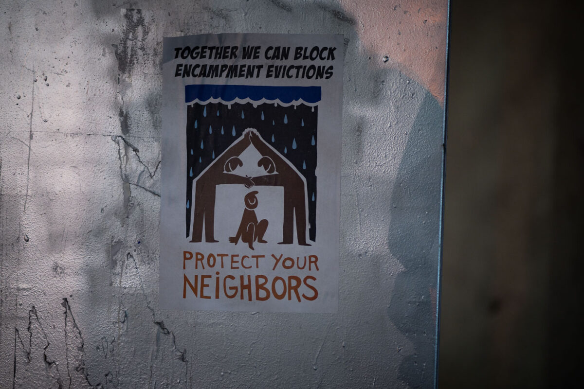 A flyer seen on a street sign that reads "Together we can block encampment evictions" "Protest your neighbors".