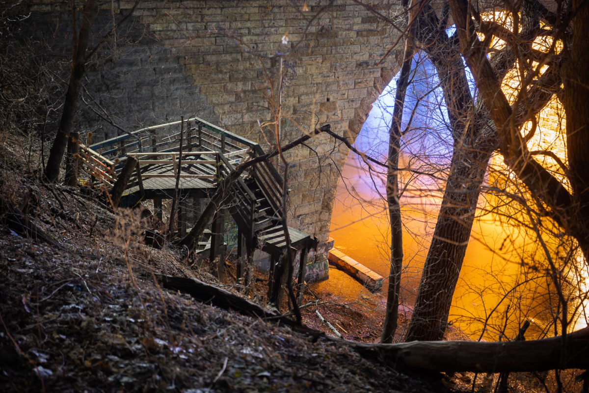 Stairs being removed near the Stone Arch Bridge.