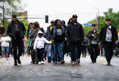 Steve Floyd with Agape Movement walks down Chicago Avenue during the 2nd anniversary of the murder of George Floyd.