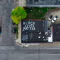 An apartment building with "Black Lives Matter" on the roof.