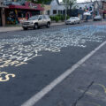The names of those who've been killed by police being repainted on Chicago Avenue.