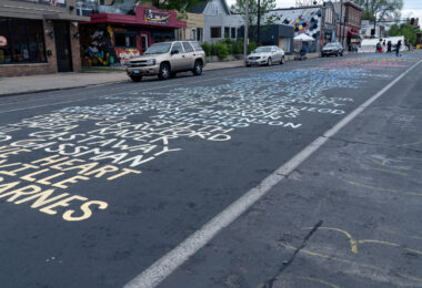 The names of those who've been killed by police being repainted on Chicago Avenue.