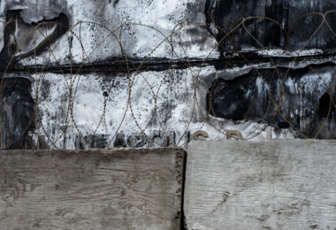 Concrete blocks and razor wire up against the former entrance of the Minneapolis Police 3rd precinct police station. The station was burned by protesters following the May 25, 2020 murder of George Floyd.