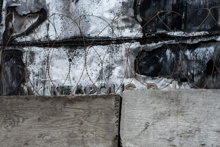 Burned Minneapolis police station concrete blocks 3 Concrete blocks and razor wire up against the former entrance of the Minneapolis Police 3rd precinct police station. The station was burned by protesters following the May 25, 2020 murder of George Floyd.