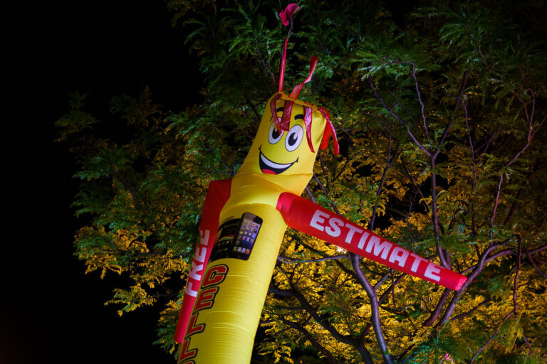 Free Estimates 2 A blow up advertisement thing in front of a store in Minneapolis.