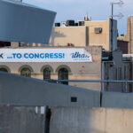 An Ilhan Omar banner on the side of a Lake Street building in South Minneapolis.