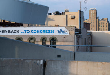 An Ilhan Omar banner on the side of a Lake Street building in South Minneapolis.