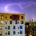 A storm moves in over a large development in Uptown Minneapolis.