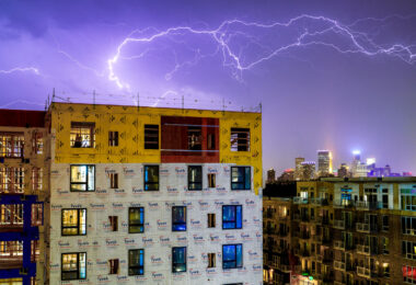 A storm moves in over a large development in Uptown Minneapolis.