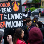 Mayor Jacob Frey and members of The Agape Movement at George Floyd Square in May 2022.