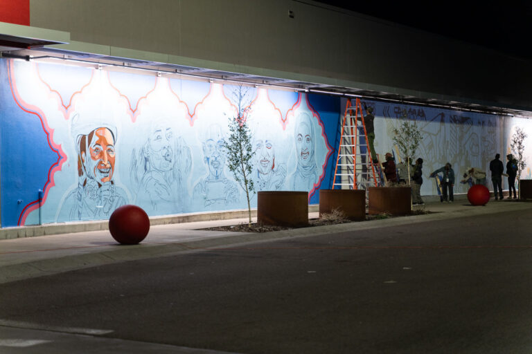 New Mural at Target East Lake Minneapolis, May 2022 4 Artists working on a new mural at the Target Store on East Lake Street in Minneapolis. The store across the street from the Minneapolis Police third precinct police station was heavily damaged following the May 25, 2020 murder of George Floyd by Minneapolis police officer Derek Chauvin.