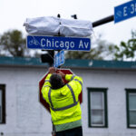 On the 2 year anniversary of his murder and a couple weeks after the commemorative street name was changed to George Perry Floyd Square, a sign was revealed. Afterwards the community held an Angelversary Candlelight Vigil at the Say Their Names Cemetery memorial.