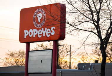 A Popeyes Louisiana Kitchen sign on Chicago Avenue in Minneapolis. The building was destroyed during the Minneapolis Uprising.