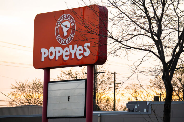 Popeyes Chicken Sign with the letter F 2 A Popeyes Louisiana Kitchen sign on Chicago Avenue in Minneapolis. The building was destroyed during the Minneapolis Uprising.