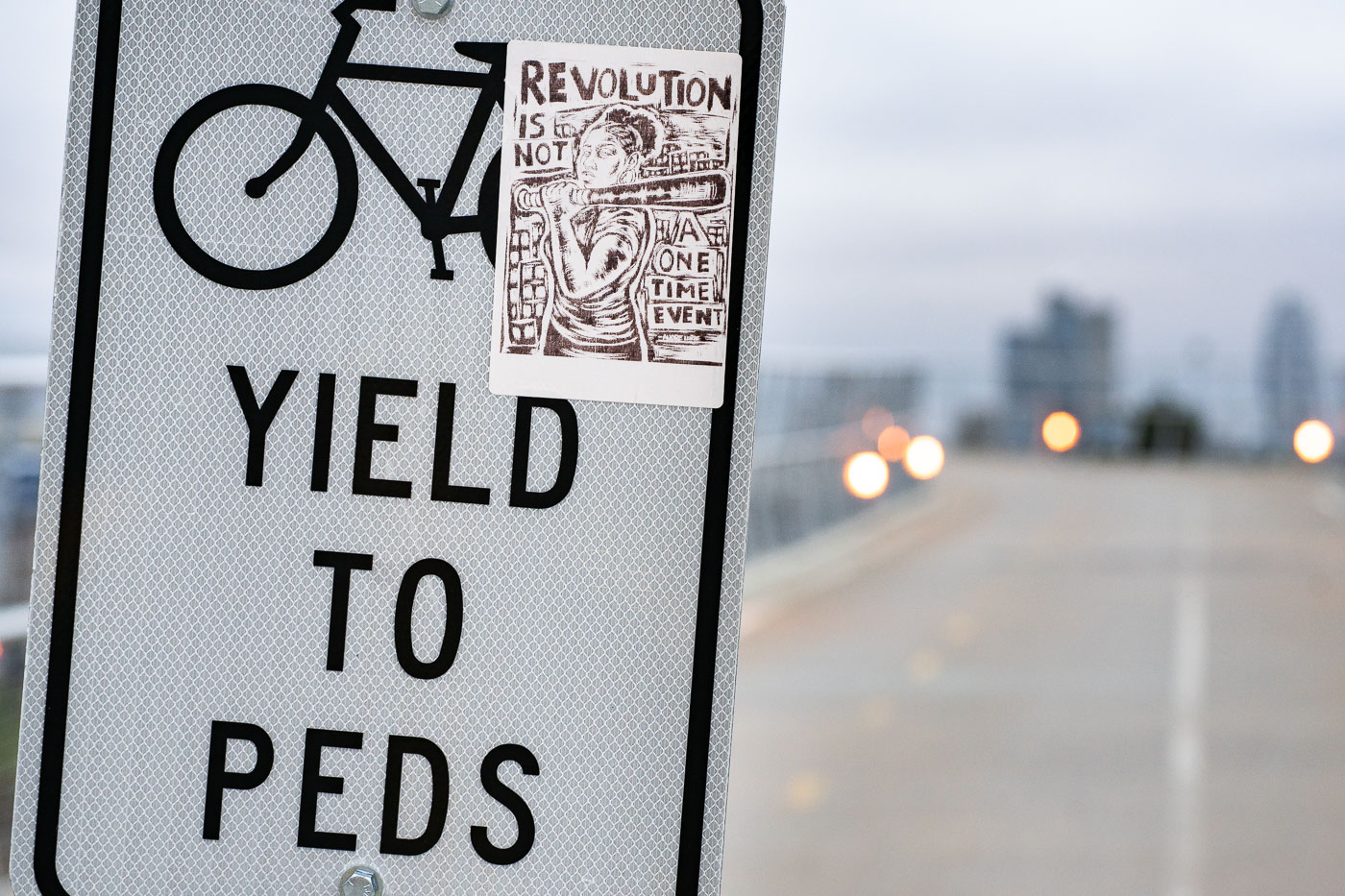 Protest Sticker on Bike–Pedestrian Sign, Minneapolis