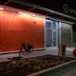 A mural being sketched out on the side of Target on East Lake Street.