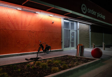 A mural being sketched out on the side of Target on East Lake Street.