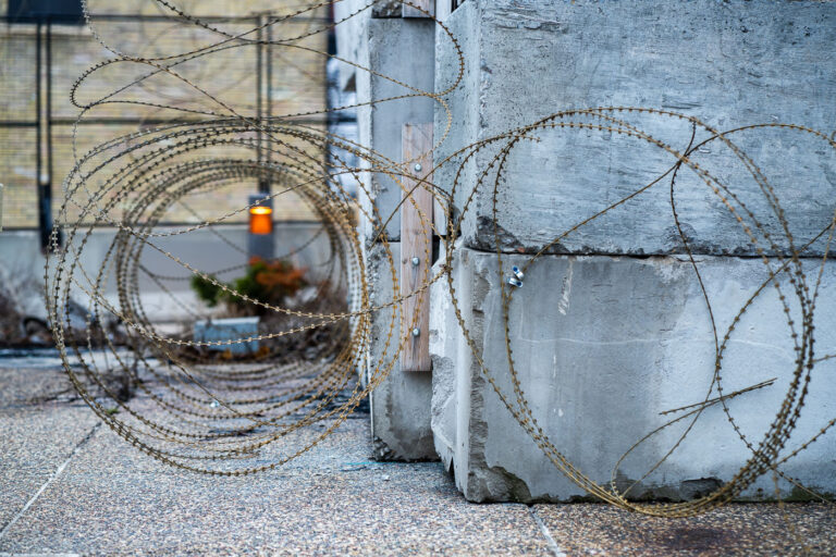 Security around burned Minneapolis 3rd Precinct police station 1 Razor wire around the concrete blocks at the burned Minneapolis 3rd Precinct police station.