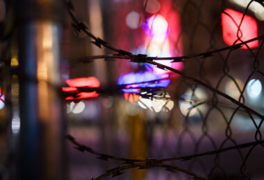 Razor wire on fencing around a parking ramp at Lake Street and Girard Ave in Uptown Minneapolis. 

The area was home to protests following the shooting death of Winston Smith at the top of the ramp by a federal task force.