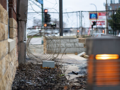 Razor wire surrounds Minneapolis Police 3rd Precinct, two years later