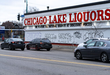 Graffiti on metal shutters covering the windows of Chicago Lake Liquors on Lake Street in Minneapolis.