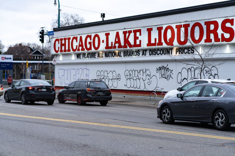Graffiti on Chicago Lake Liquor Window Shutters 3 Graffiti on metal shutters covering the windows of Chicago Lake Liquors on Lake Street in Minneapolis.