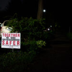 A yard sign reading "Together we make our neighborhood safer" in South Minneapolis.
