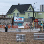 Graffiti on shutters over U7 Nails on Chicago Avenue in Minneapolis.