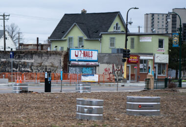 Graffiti on shutters over U7 Nails on Chicago Avenue in Minneapolis.