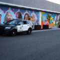 Artists drawing a new mural on the side of the East Lake Target in Minneapolis. The mural features the fists from 38th and Chicago, George Floyd Square.