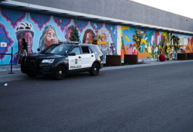 Artists drawing a new mural on the side of the East Lake Target in Minneapolis. The mural features the fists from 38th and Chicago, George Floyd Square.