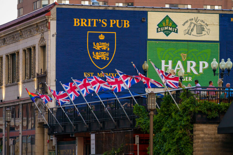 Flags at Brit's Pub on Nicollet Mall, Minneapolis 3 Brit's Pub in downtown Minneapolis on a summer evening.