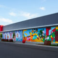 A mural on the Target Store across from the third precinct. "As part of our plan to reopen the store, we committed to co-creating permanent murals on the store’s exterior that reflect the Lake Street community." 7 local artists shared their interpretations of the words  "rooted, change, resilience, healing, growth, renewal and together."