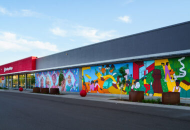 A mural on the Target Store across from the third precinct. "As part of our plan to reopen the store, we committed to co-creating permanent murals on the store’s exterior that reflect the Lake Street community." 7 local artists shared their interpretations of the words  "rooted, change, resilience, healing, growth, renewal and together."