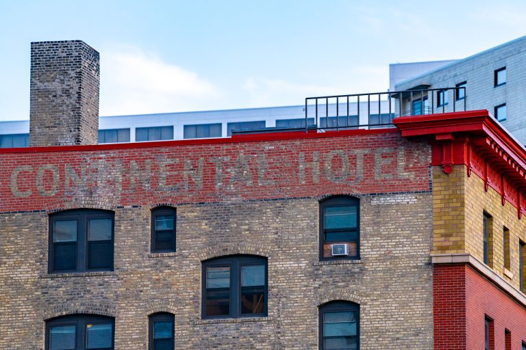Continental Hotel Ghost Sign, Downtown Minneapolis 4 Continental Hotel, a low-income housing building in downtown Minneapolis with red brick and faded ghost signage.