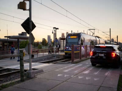 Franklin Ave Light Rail Station with Metro Transit Squad Car