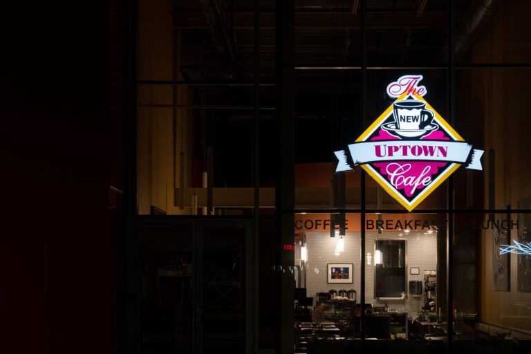 Uptown Cafe sign on Hennepin Avenue 2 Uptown Cafe sign glowing in a storefront window in Minneapolis at night