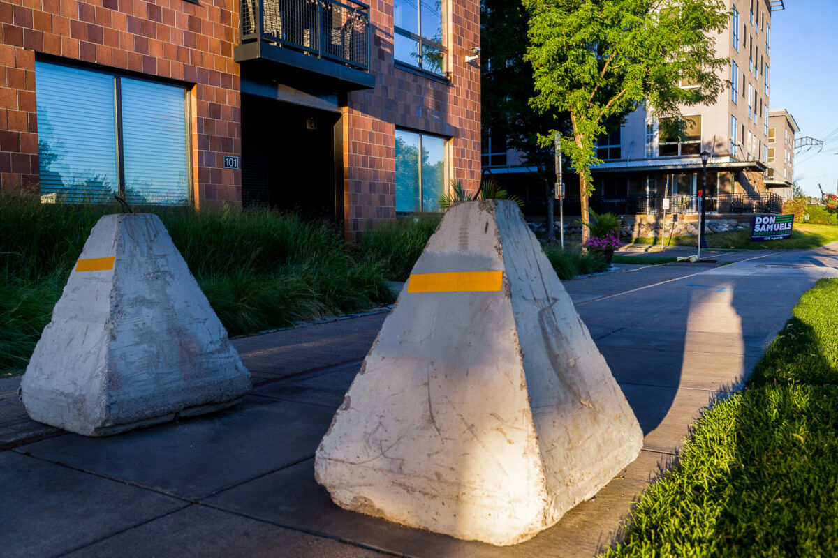 Barricades placed on sidewalks near the Stone Arch Bridge following incidents on the 4th of July.