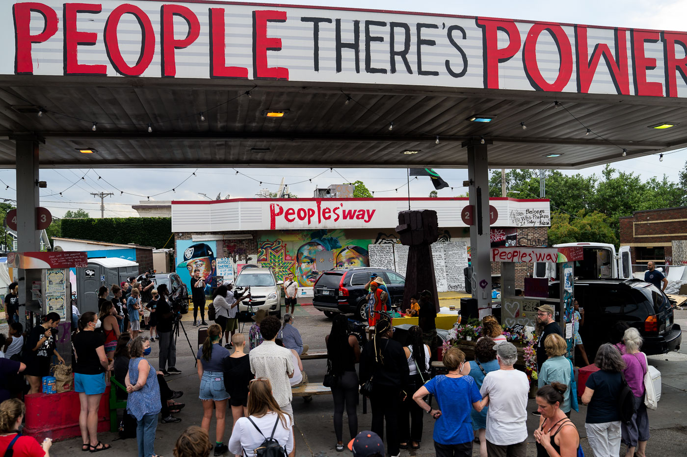 A rally for solidarity with Akron was held at George Floyd Square in Minneapolis, Minnesota, a site that has become a focal point for protest and community organizing since the murder of George Floyd in 2020. Speakers, including George Floyd's aunt Angela Harrelson, addressed the crowd, expressing solidarity with Jayland Walker, who was killed by police in Akron, Ohio. Artists were present, working on a raised fist sculpture intended for Akron, symbolizing shared struggles and support. The event took place at the "Peoples Way" gas station, which has been transformed into a space for activism and remembrance.