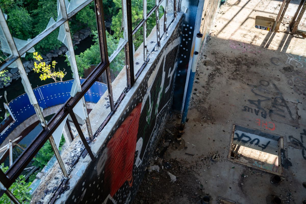 Overhead view of deteriorated industrial machinery and graffitied surfaces inside the abandoned Fruen Mill in Minneapolis.