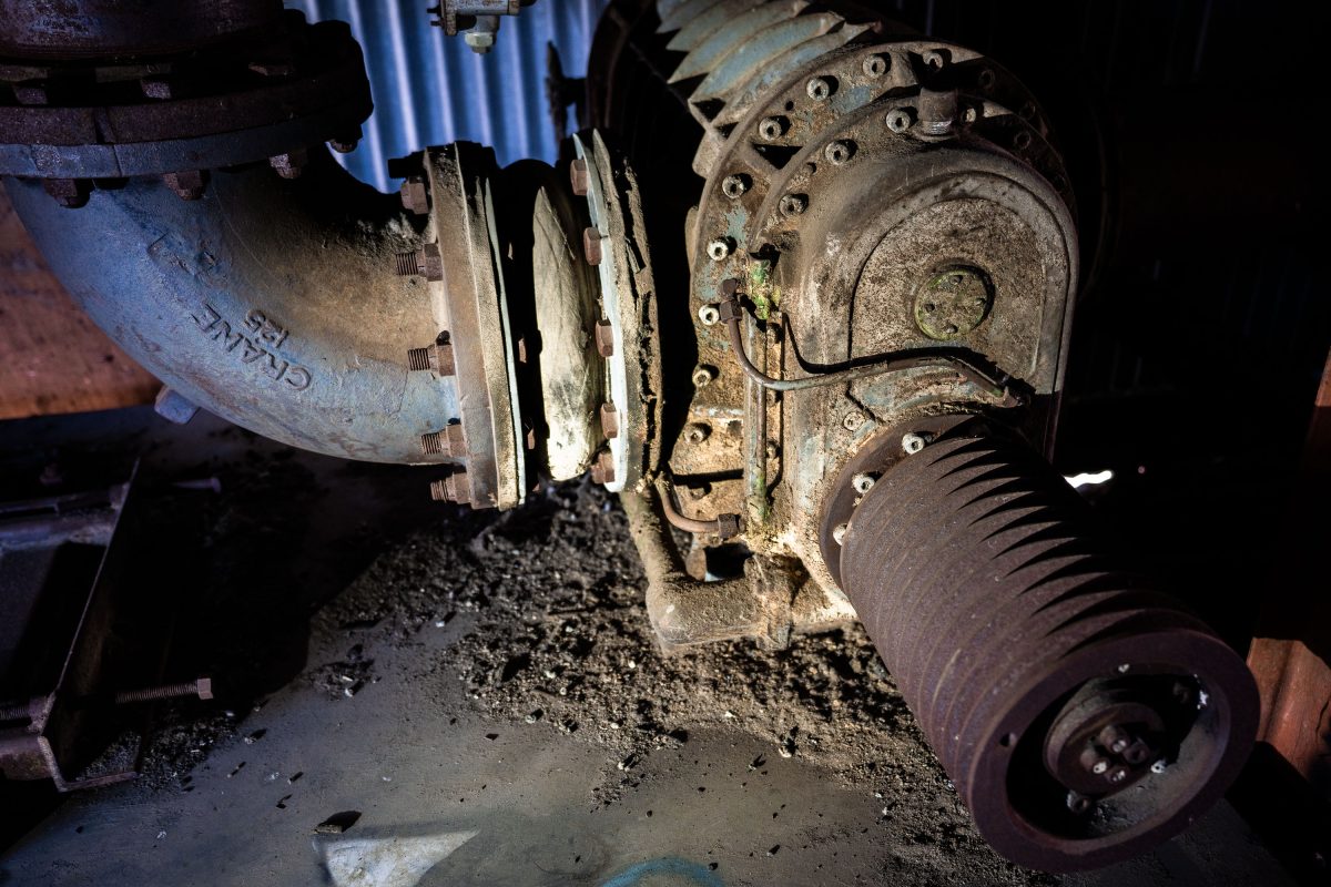 Deteriorated brake assembly and machinery inside the abandoned Fruen Mill in Minneapolis.
