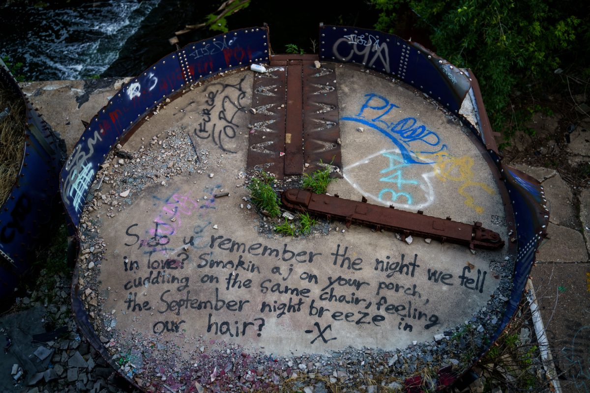 Handwritten message on concrete surface inside abandoned Fruen Mill in Minneapolis.