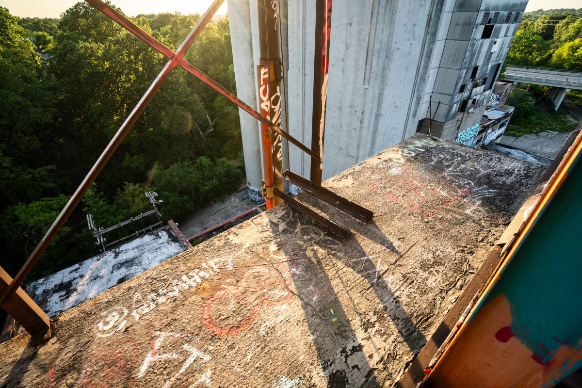 Elevated view of rusted metal structural beams and graffiti-covered surfaces inside the abandoned Fruen Mill in Minneapolis.