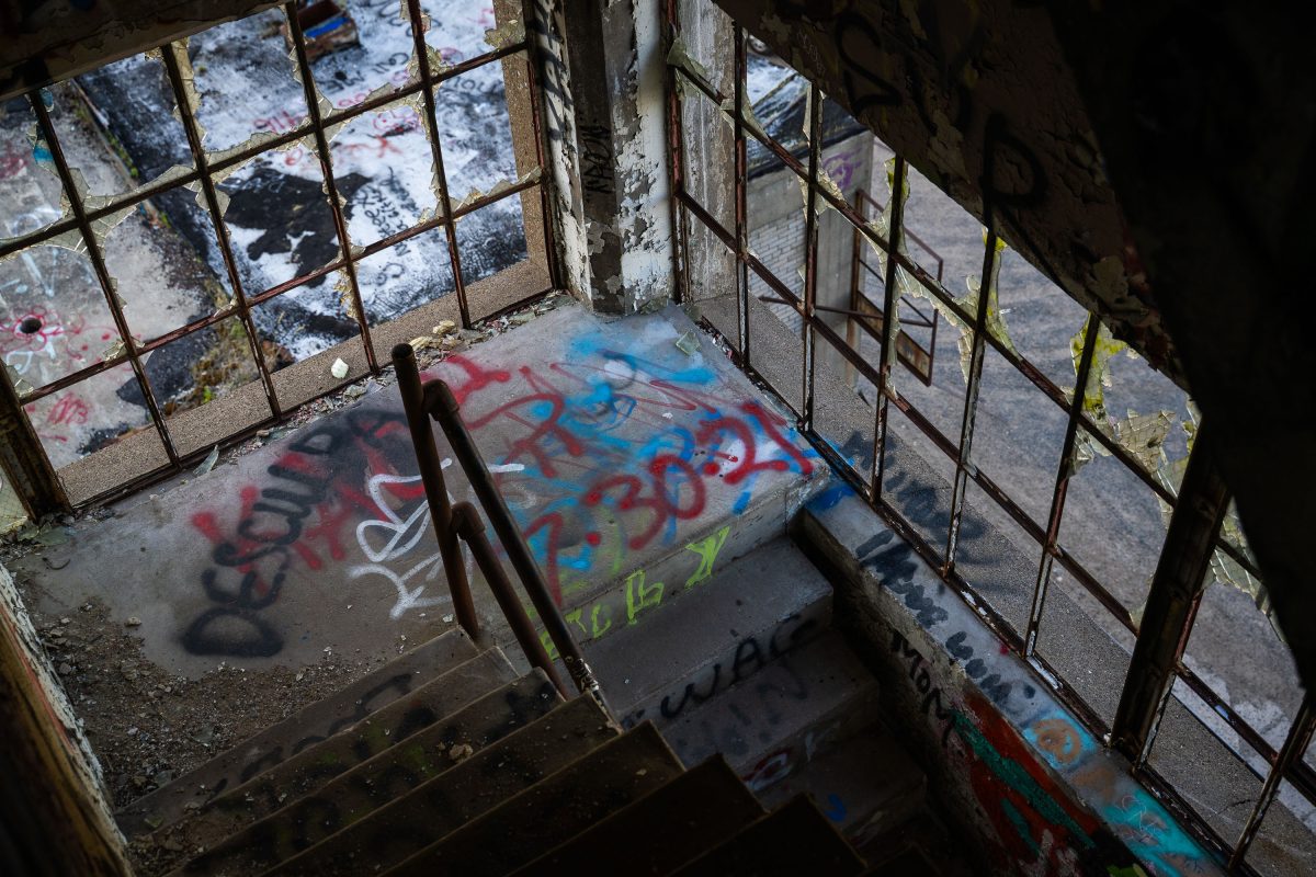 Graffiti-covered stairwell inside the abandoned Fruen Mill industrial complex in Minneapolis.