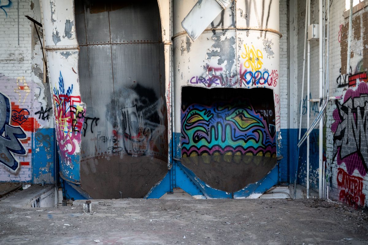 Colorful graffiti covers industrial storage tanks inside the abandoned Fruen Mill in Minneapolis.