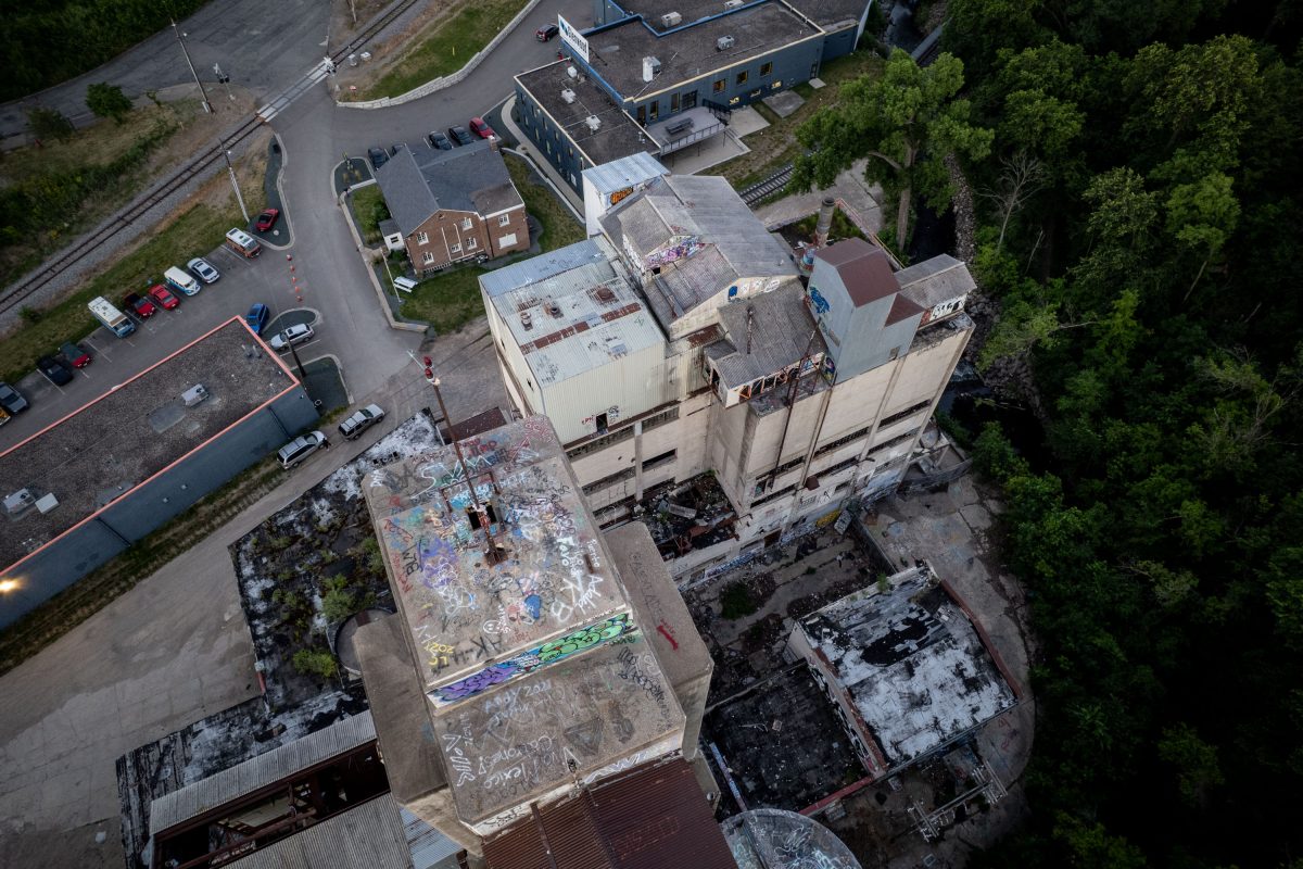 Aerial view of the abandoned Fruen Mill complex in Minneapolis showing deteriorating concrete structures and surrounding