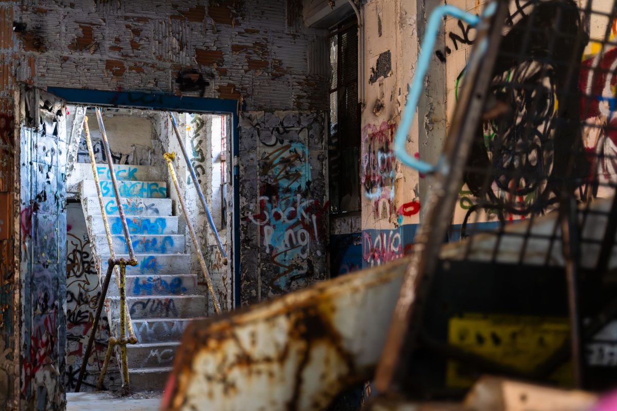 Deteriorated staircase and graffitied walls inside the abandoned Fruen Mill in Minneapolis.