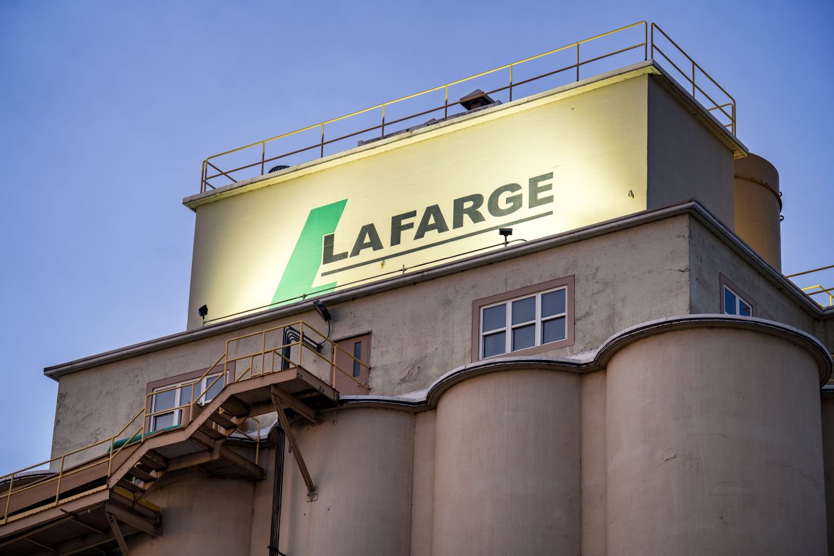 Lafarge cement facility with storage silos and rooftop sign in Green Bay, Wisconsin.